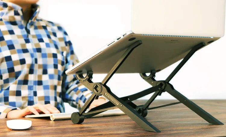 Black folding portable laptop stand made of reinforced nylon, shown in folded position.