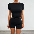 Women's solid colour viscose sports suit comprising a short-sleeve t-shirt and elastic waist shorts.