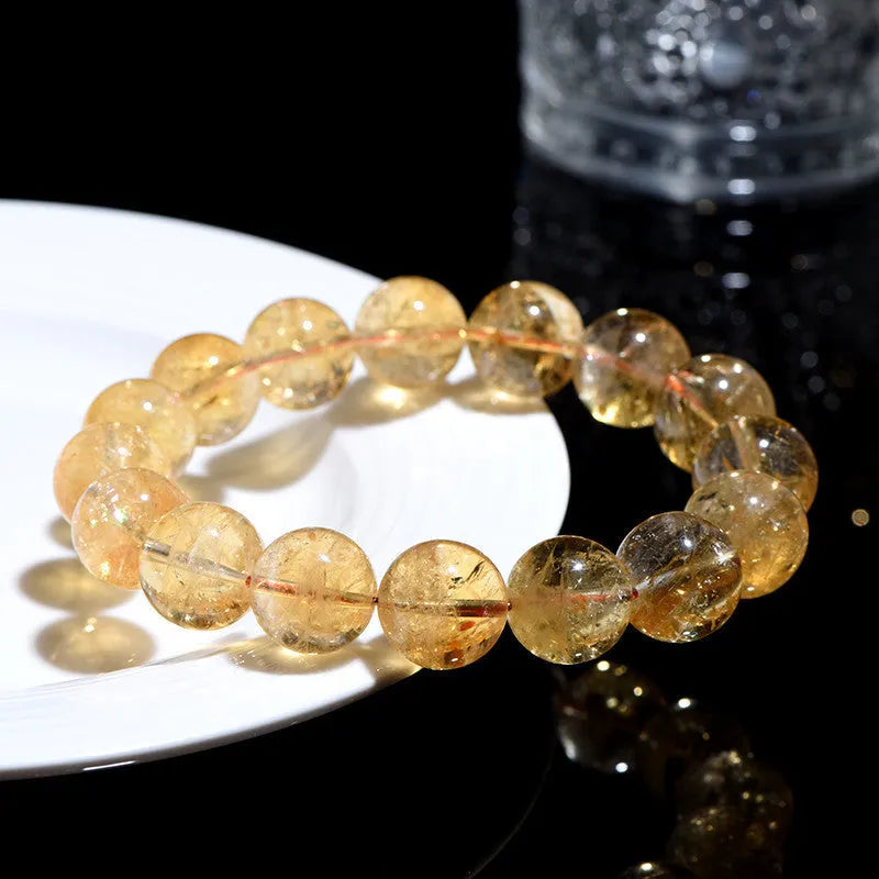 Natural yellow citrine gemstone bracelet in Asestelle design, showing single and multiple strand options.