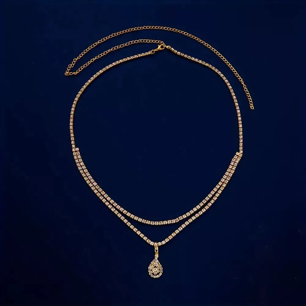 Gold or silver waist chain with water drop pendant and rhinestone accents, lobster buckle clasp
