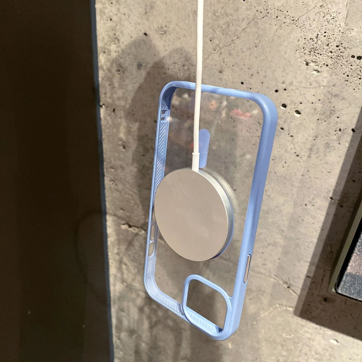 Transparent acrylic MagSafe phone case showing magnetic ring, compatible with iPhone 12 and 13 models