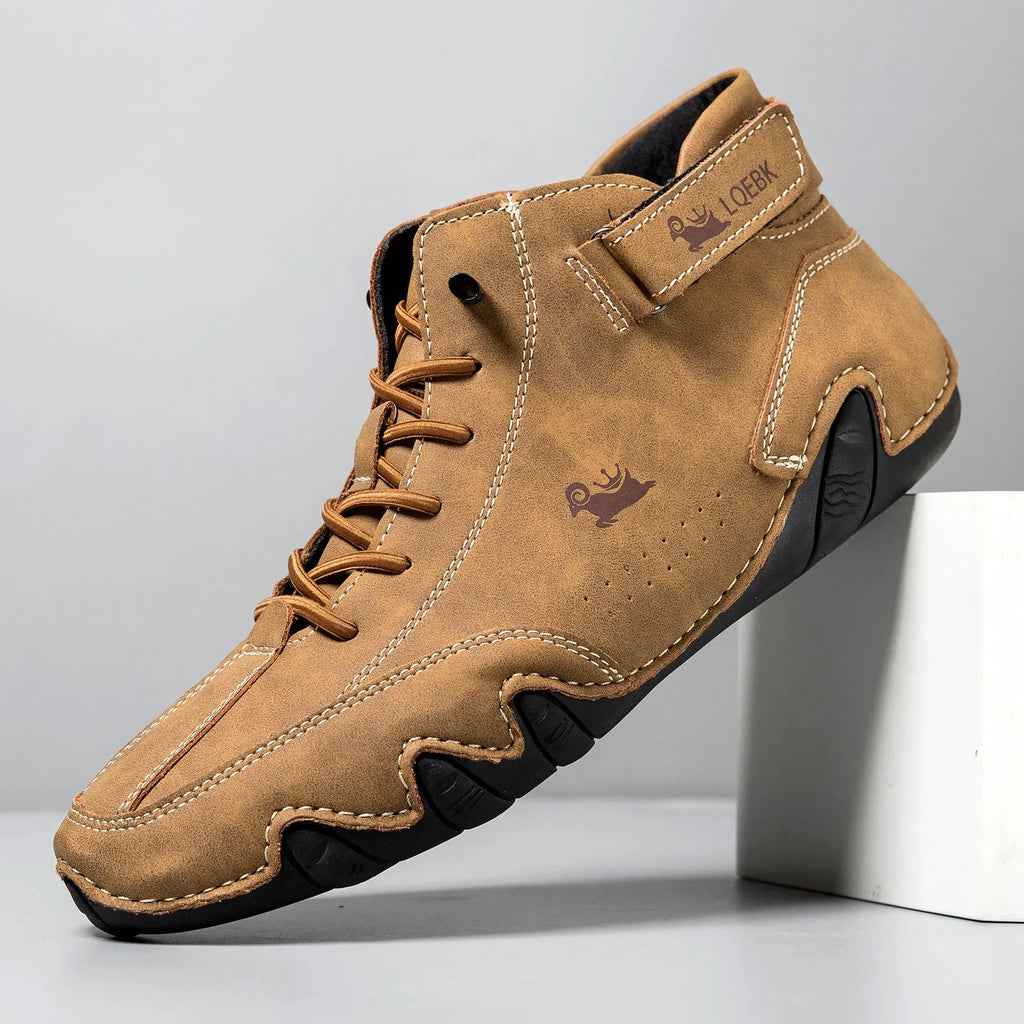 Men's brown high-top Martin boots with round toe and flat rubber sole on a white background.
