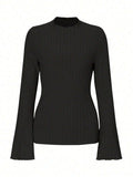 Black long sleeve slim fit top with lantern sleeves and a sunken stripe pattern