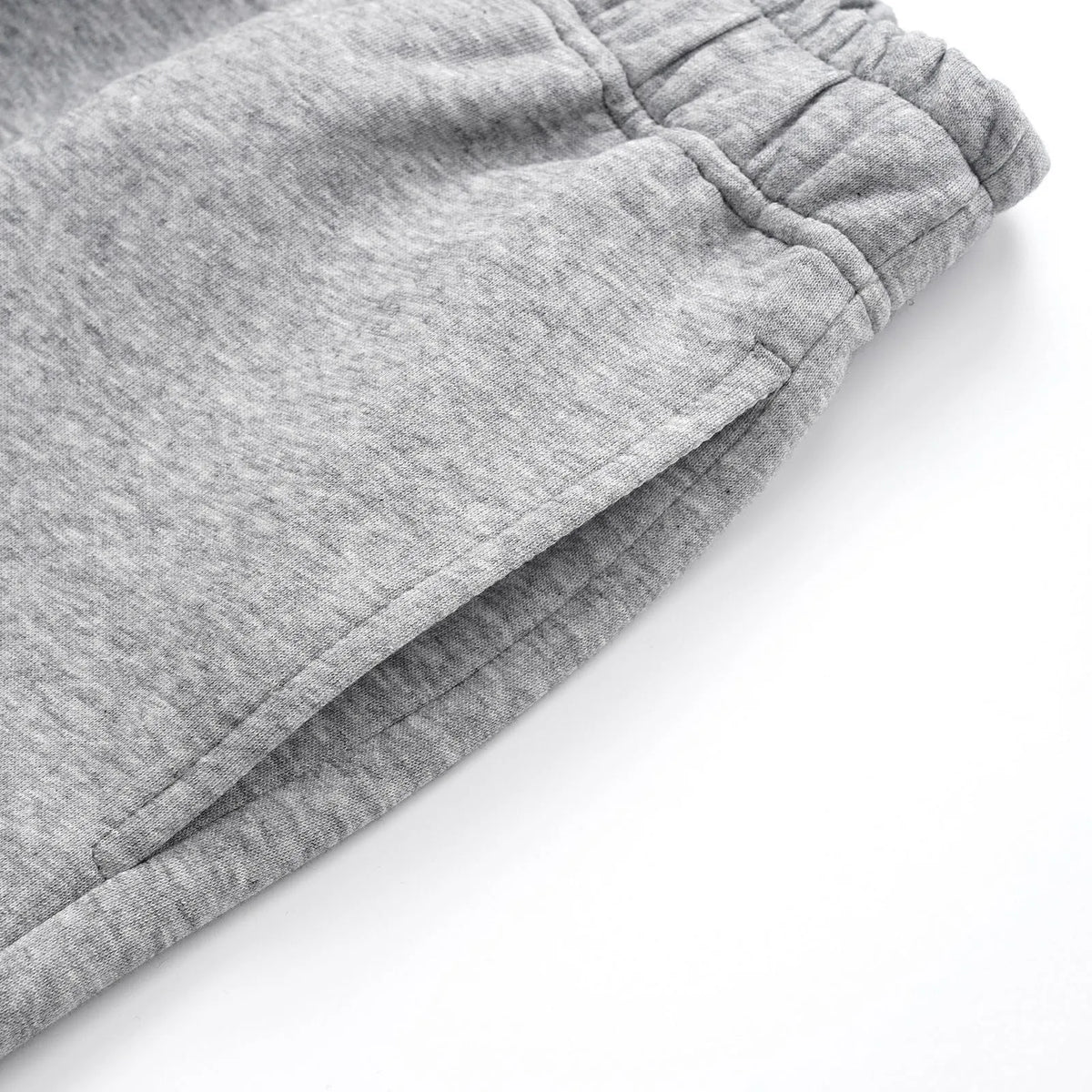 Men's grey straight-leg cotton casual trousers with an elasticated waistband laid flat.