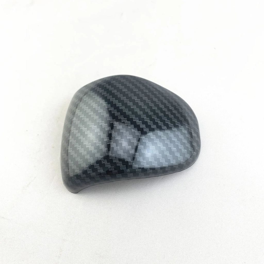 Car gear shift cover with carbon fibre pattern finish