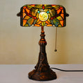 10-inch Tiffany table lamp with stained glass design and resin base on wooden desk