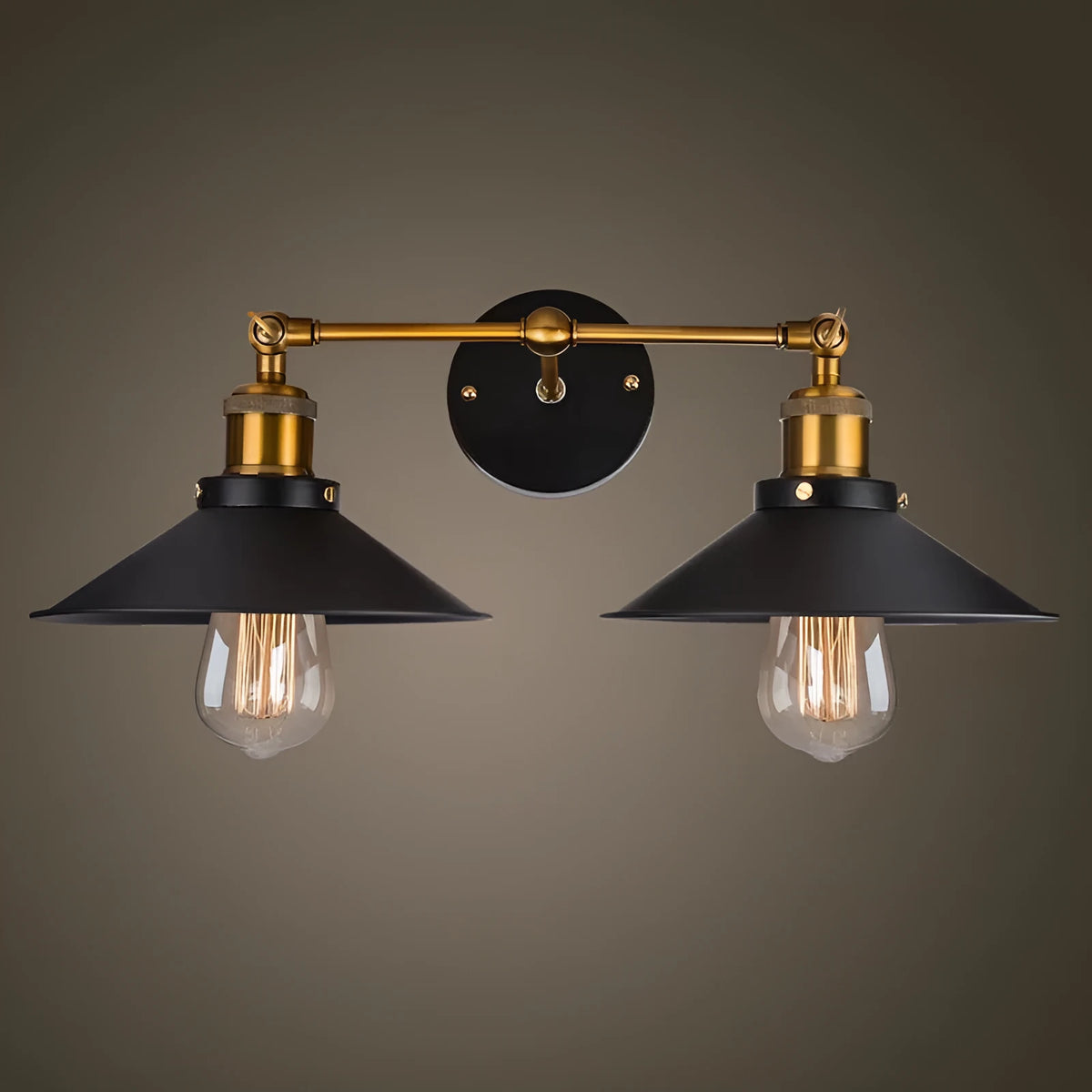 Black double head American retro industrial style iron wall lamp on a wall.