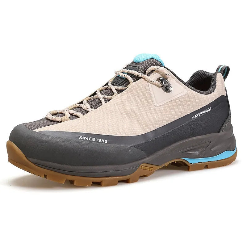 Men's low-top mountain climbing shoes in black with leather mesh upper and non-slip rubber outsole