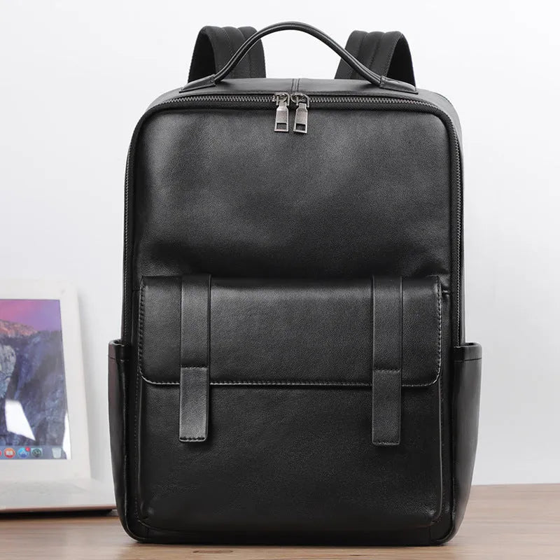 Men's black genuine leather large capacity laptop backpack with weave details.
