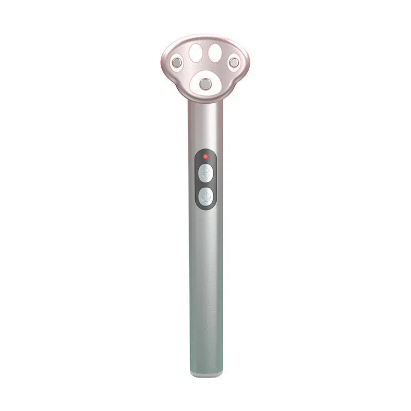 Pink gradient cat's paw shaped eye massager with micro-current vibration and colour light therapy.