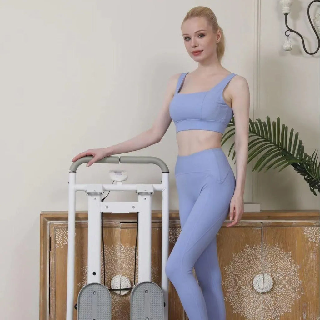 Foldable white home treadmill with climbing frame in unfolded position for indoor exercise