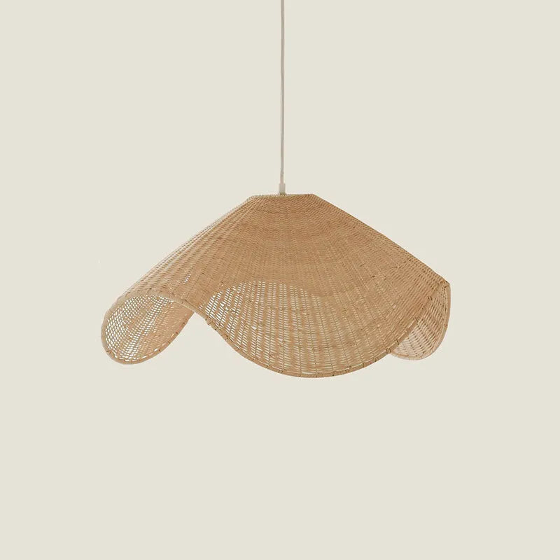 Handmade natural rattan and willow bamboo chandelier with warm LED light in a rustic setting.
