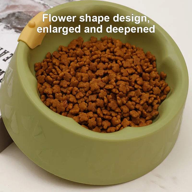 Green plastic pet double bowl with food and water compartments showing anti-tipping design