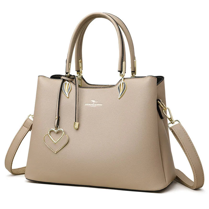 Women's black PU leather messenger bag with multi-layer shoulder strap and sewing thread detailing