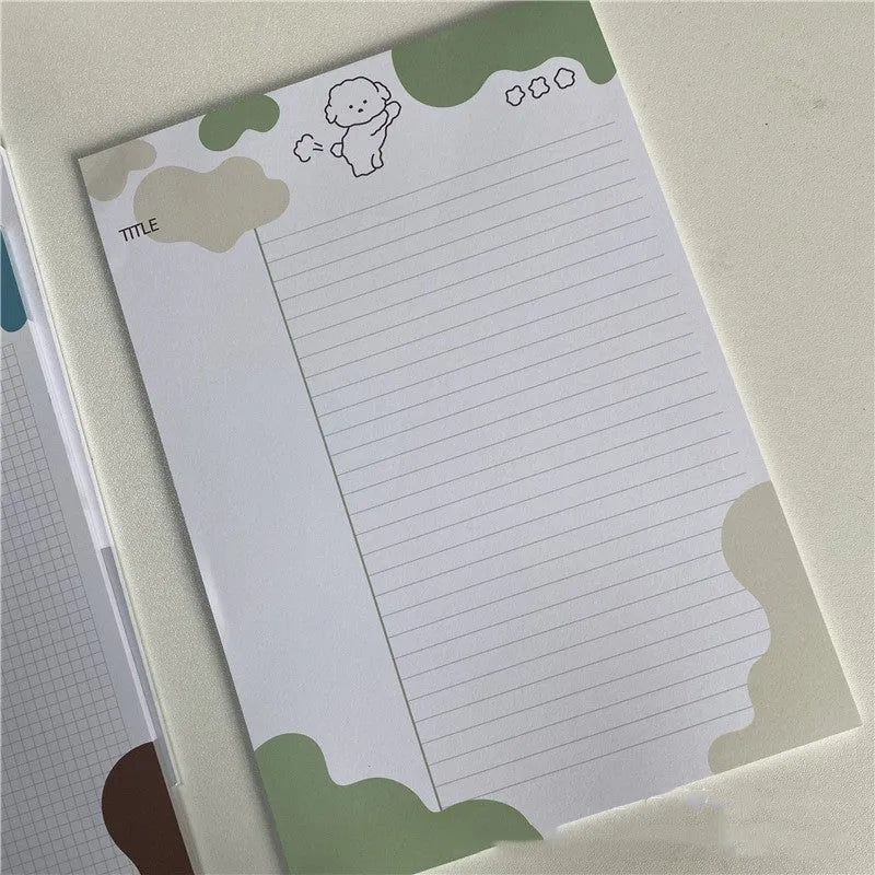 B5 sticky note pad with dog illustration cover, showing one sheet peeled back to reveal adhesive.