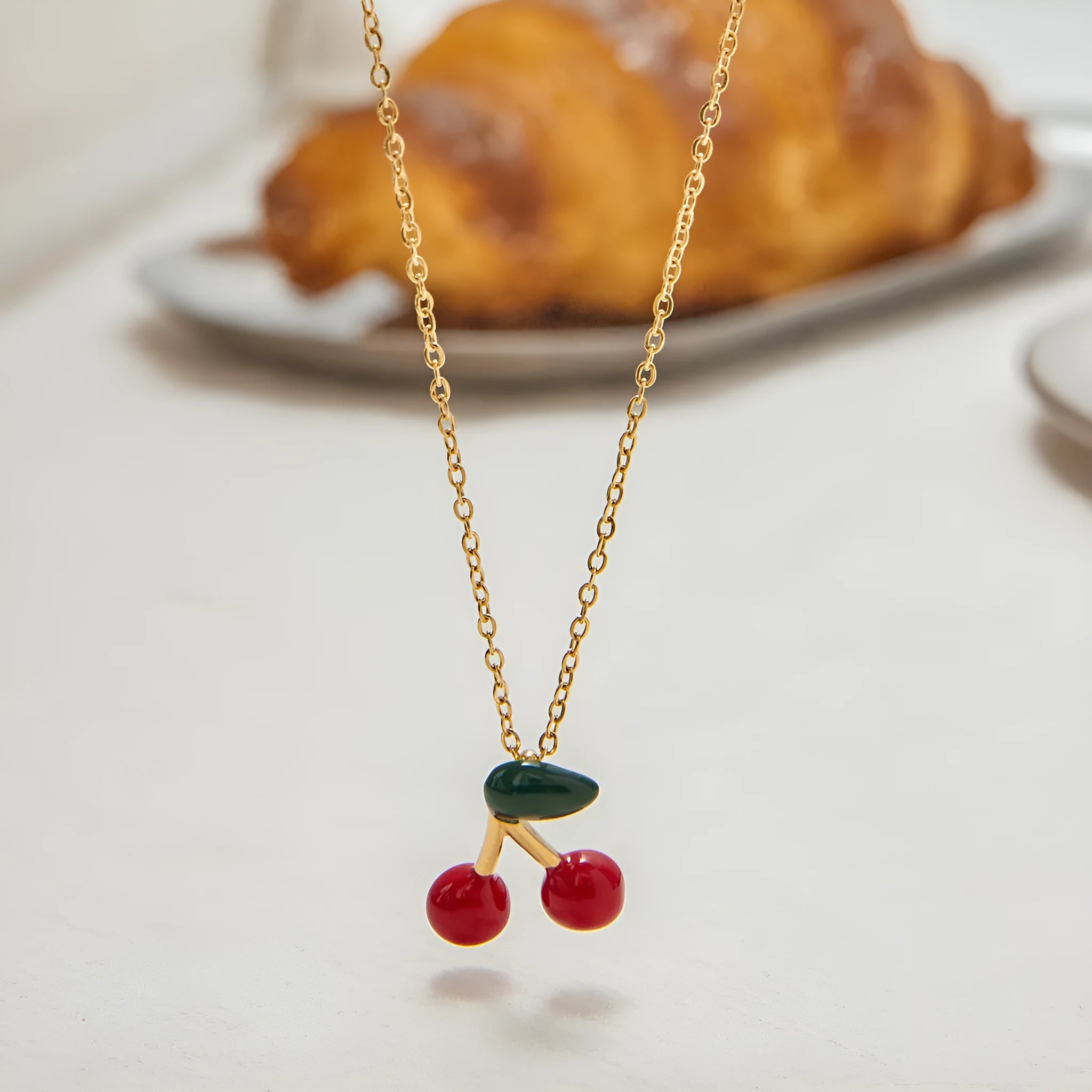 Stainless steel cherry-shaped pendant necklace with titanium steel finish on a regular chain, available in JDN0303030-1 colour