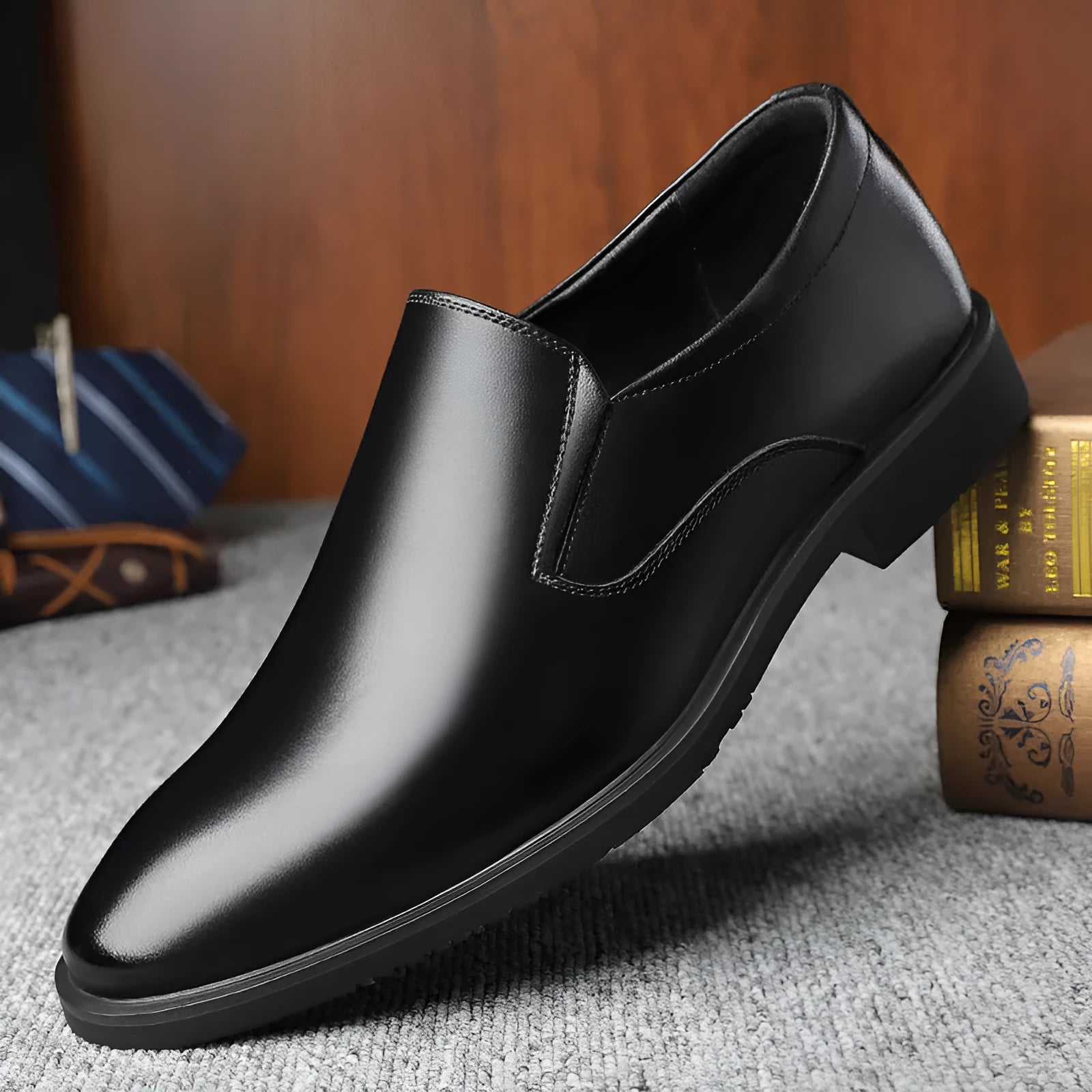 Men's black leather business casual slip-on shoes with rubber sole and sewing line detail.