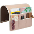 Beige felt phone organising shopping bag on a sofa with a mobile phone inside