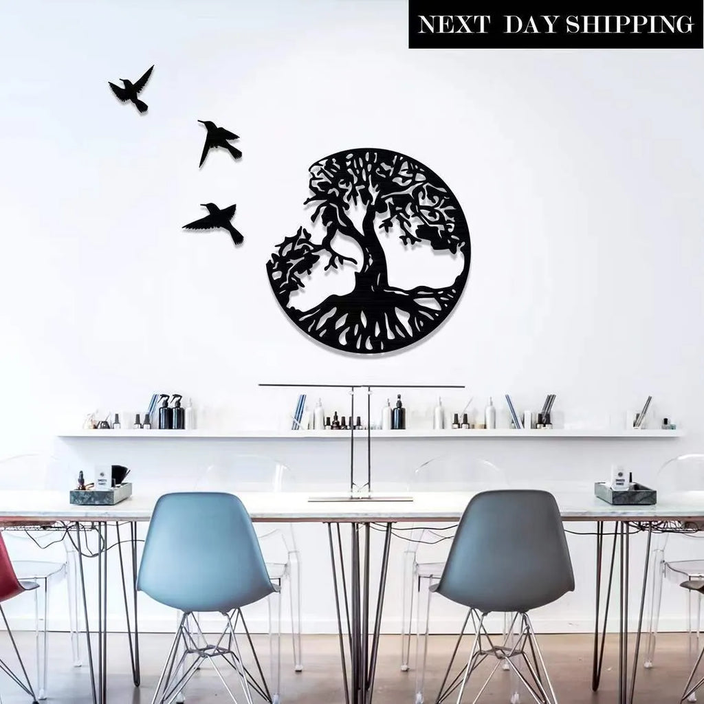 Black iron wall art wind chime hanging on a wall with a simple modern design