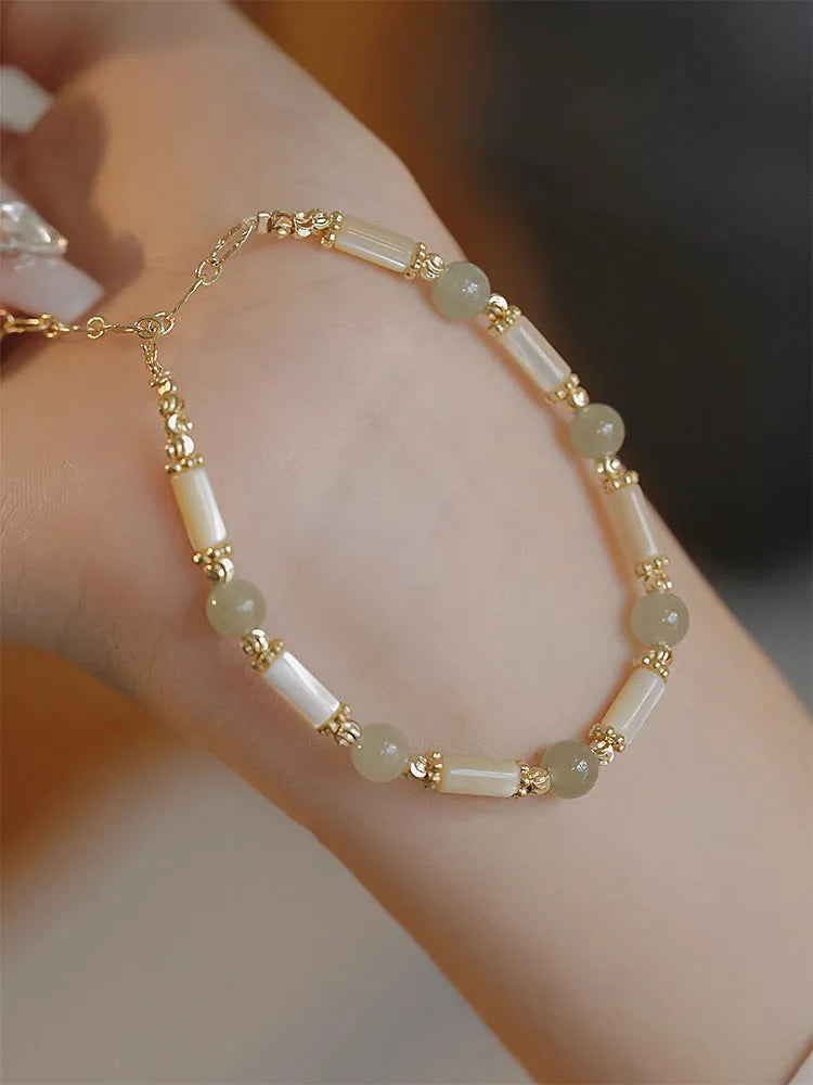 Hetian jade bamboo joint bracelet 6mm bead size on display against neutral background