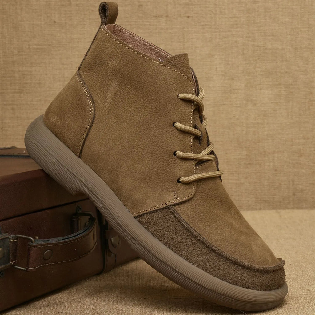 British style grey leather Martin boots with lace-up front and wedge heel on a rubber sole.