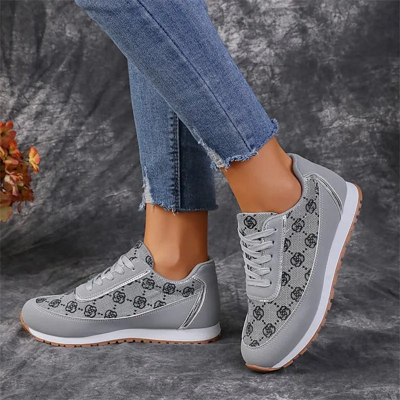 Flower print lace-up sneakers in camel with round toe and rubber sole