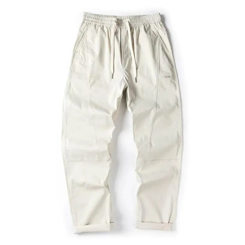 Casual wide-leg cotton trousers in milky white colour showing pants-mouth style