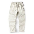 Casual wide-leg cotton trousers in milky white colour showing pants-mouth style