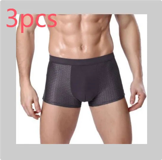 Men's solid colour ice silk boxer briefs with U convex design on a mid waist.