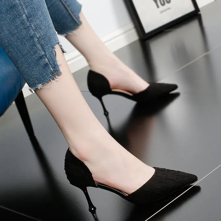 Women's black pointed toe stiletto high heels with PU leather upper and thin heel.