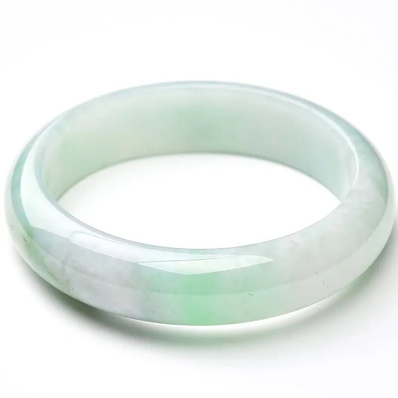 Light green jade bracelet showing natural stone texture on wrist