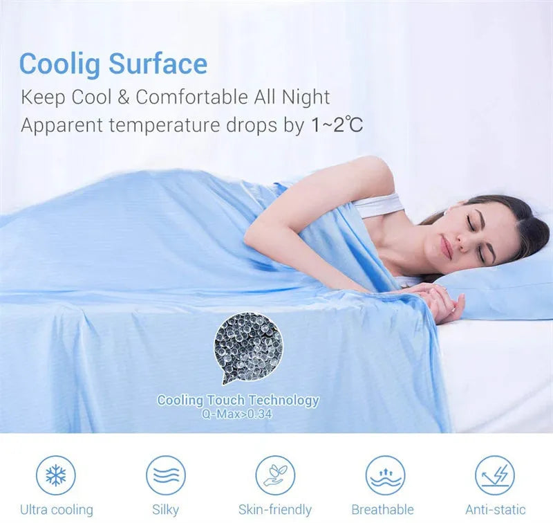 Blue cooling blanket with Japanese Q-Max fibres on a bed.