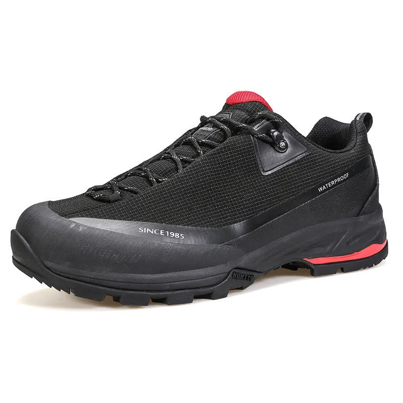 Men's low-top mountain climbing shoes in black with leather mesh upper and non-slip rubber outsole