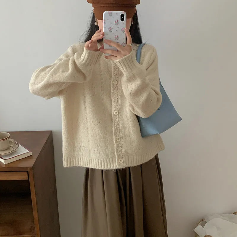 Artistic retro loose-fit viscose knitwear cardigan coat in apricot, shown open.