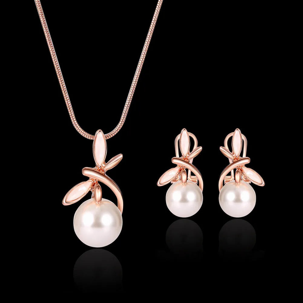 Rose gold bridal jewellery set with pearl necklace and earrings featuring alloy and artificial gems