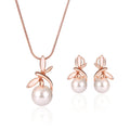 Rose gold bridal jewellery set with pearl necklace and earrings featuring alloy and artificial gems