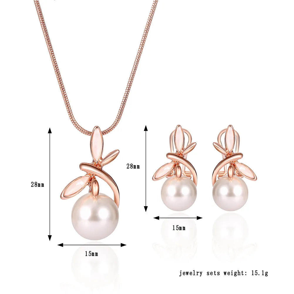 Rose gold bridal jewellery set with pearl necklace and earrings featuring alloy and artificial gems