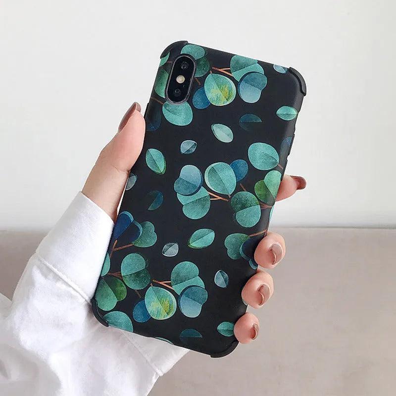 Black silicone iPhone case with raised leaf pattern texture on back