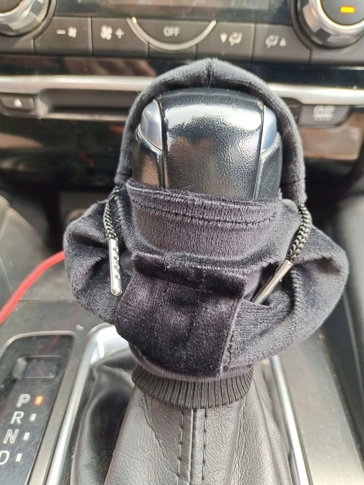 Pure cotton car gear lever decoration in red, shown on a gear stick.
