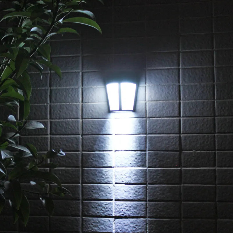 Solar-powered outdoor wall lamp with six LEDs and IP65 waterproof rating for garden and courtyard lighting