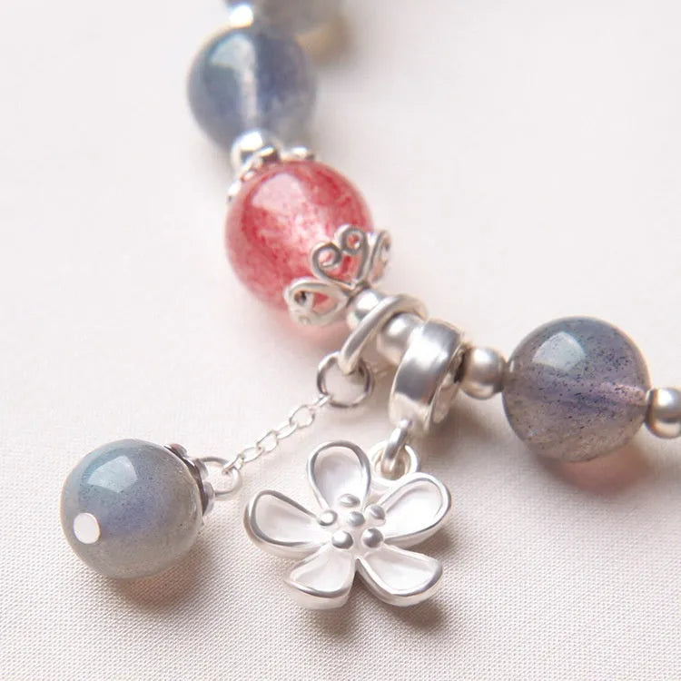 Women's crystal bracelet with grey moonlight 7.5mm beads and animal zodiac charms