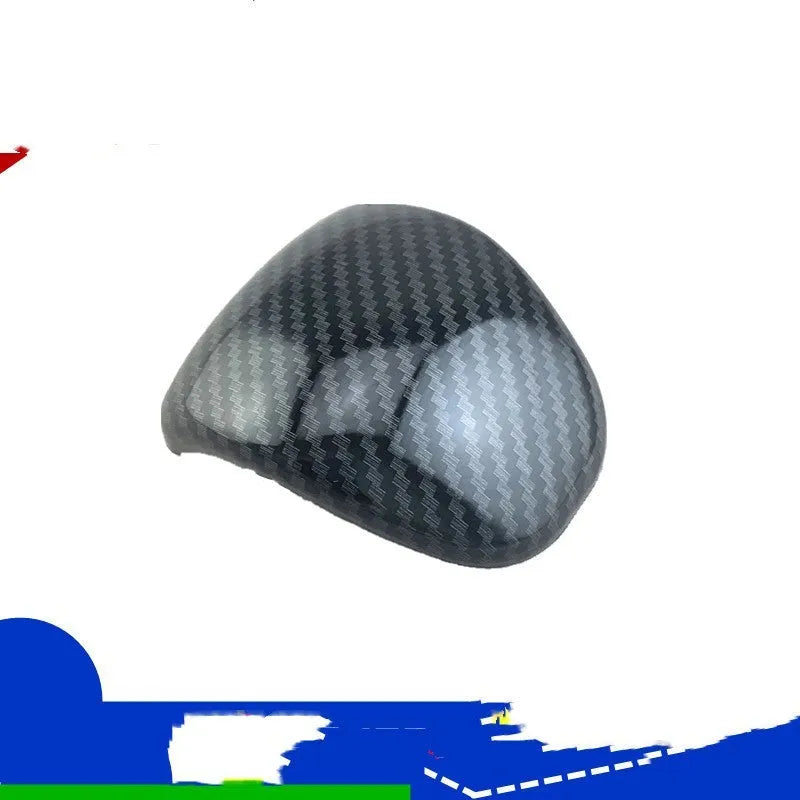 Car gear shift cover with carbon fibre pattern finish