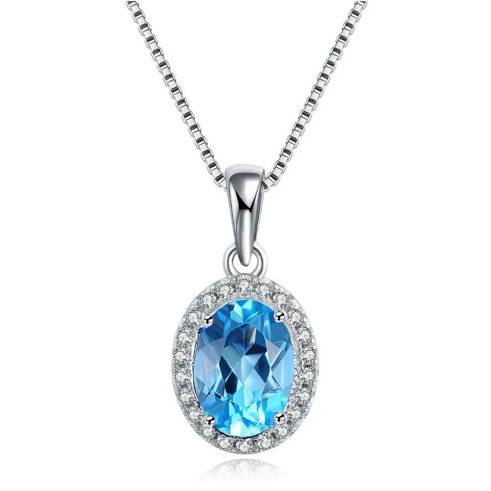 Geometric 925 sterling silver jewellery set with blue topaz stones, showing earrings, ring, pendant and necklace.