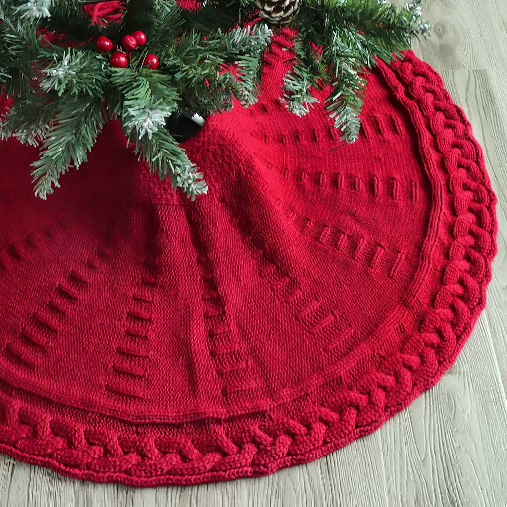 Round wool knitted Christmas tree skirt, 122cm diameter, in red or milky white, shown around a tree base