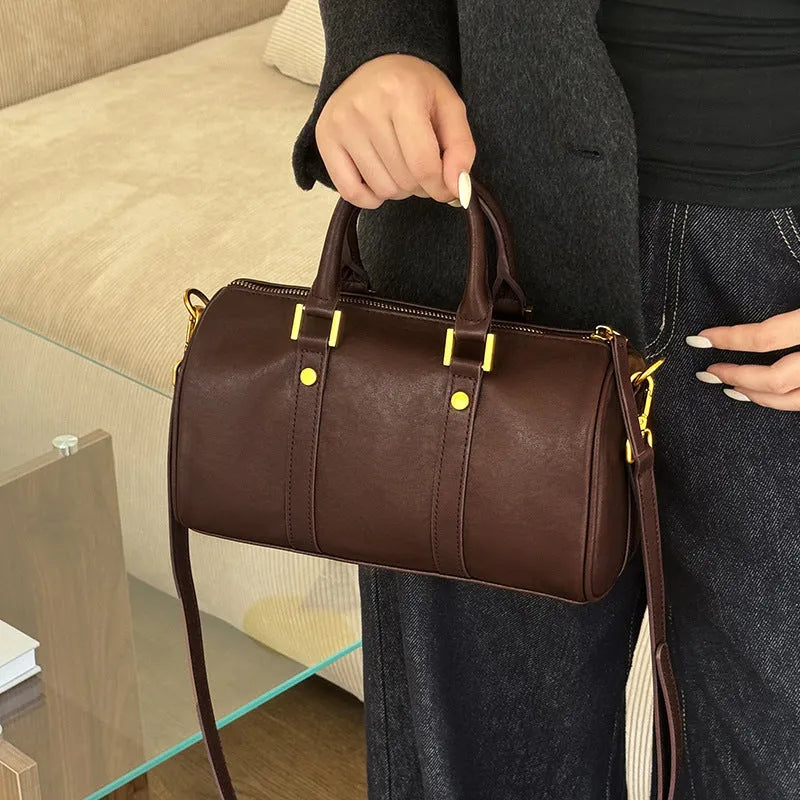 Retro portable cowhide crossbody bag in pillow shape with sewing thread detail, black colour