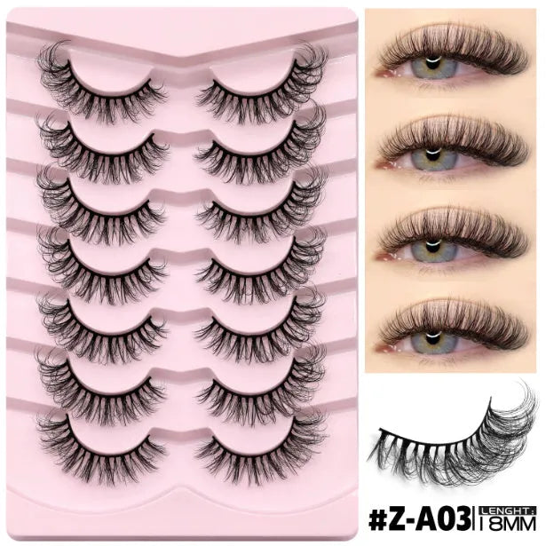 Box of artificial fibre false eyelashes in a natural long thick style with a tube of adhesive glue