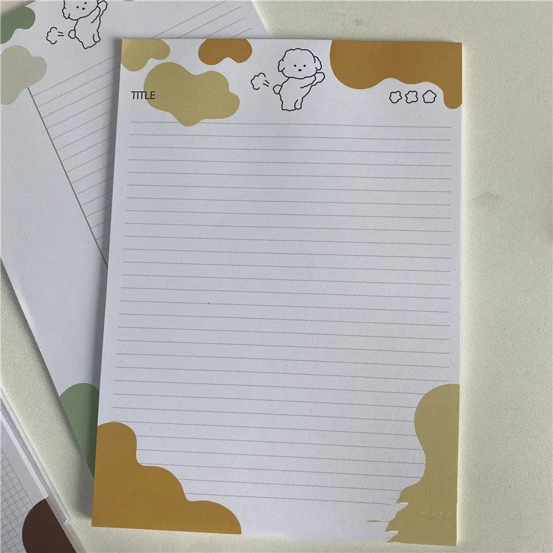 B5 sticky note pad with dog illustration cover, showing one sheet peeled back to reveal adhesive.