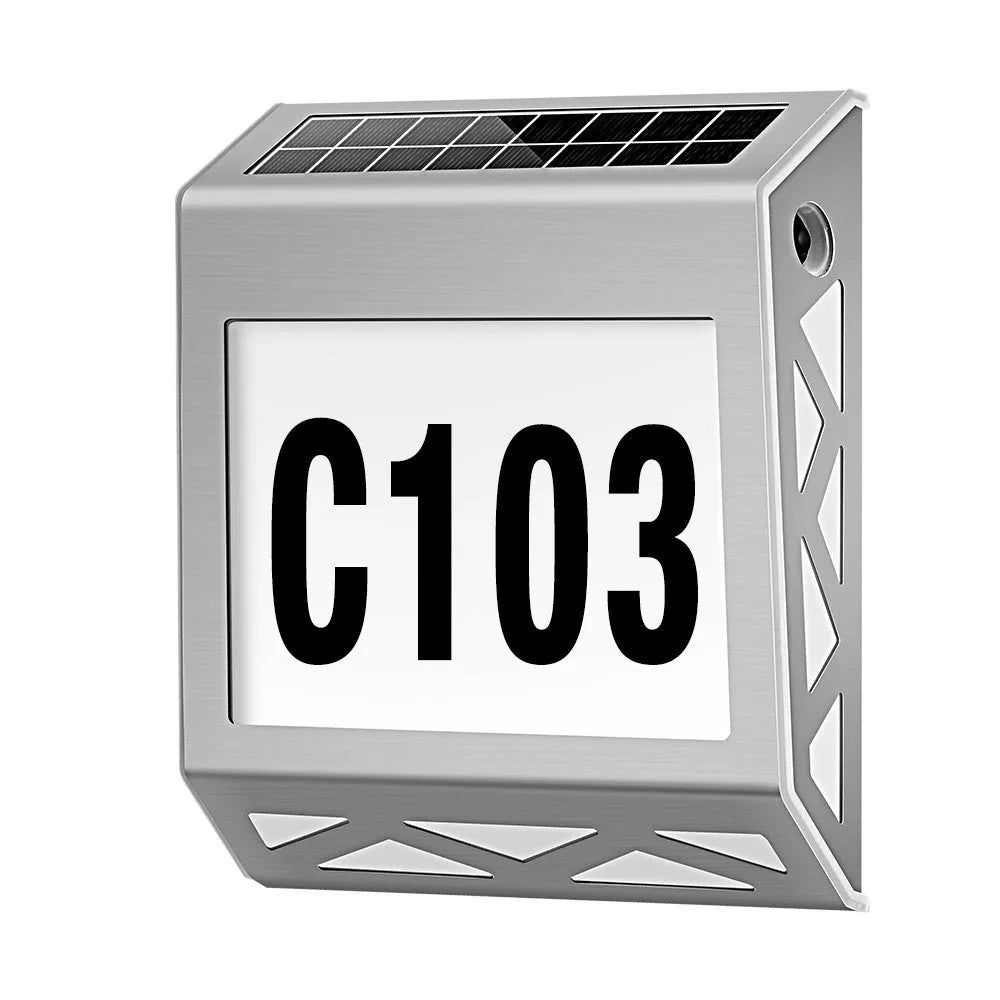 Black solar powered waterproof doorplate light with LED house numbers mounted on exterior wall