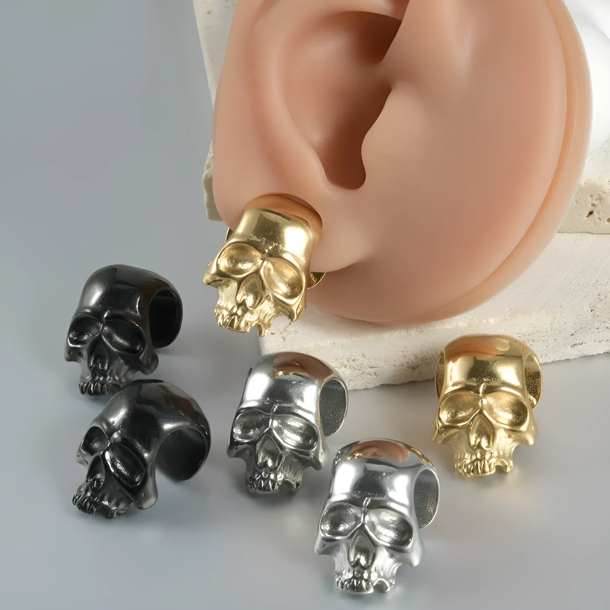 Stainless steel earrings with hollow skull and Buddha head geometric designs in multiple colour options