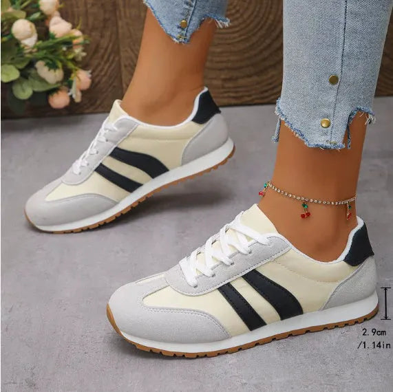 Blue and grey striped Cortez-style leisure sports shoes with a flat rubber sole.